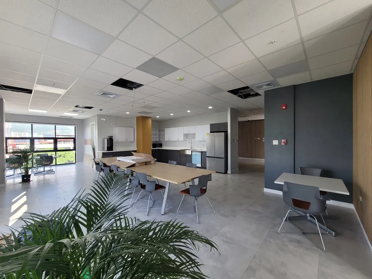 ZS office breakout area with kitchenette and refined commercial finishes